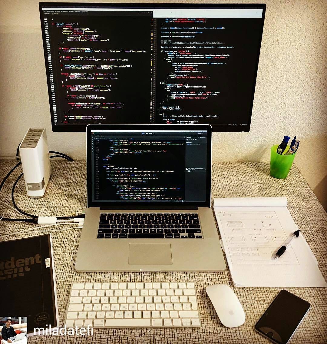 A typical programmer's desktop includes multiple screens.